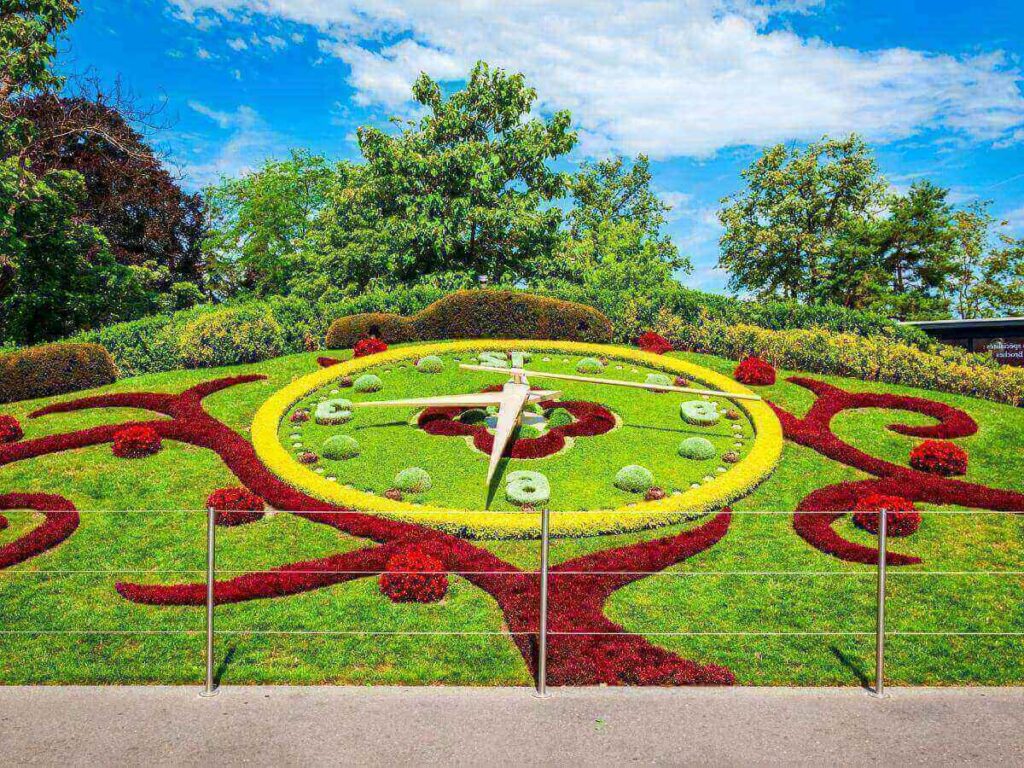 Flower Clock in Jardin Anglais with Lake Geneva and promenade beyond