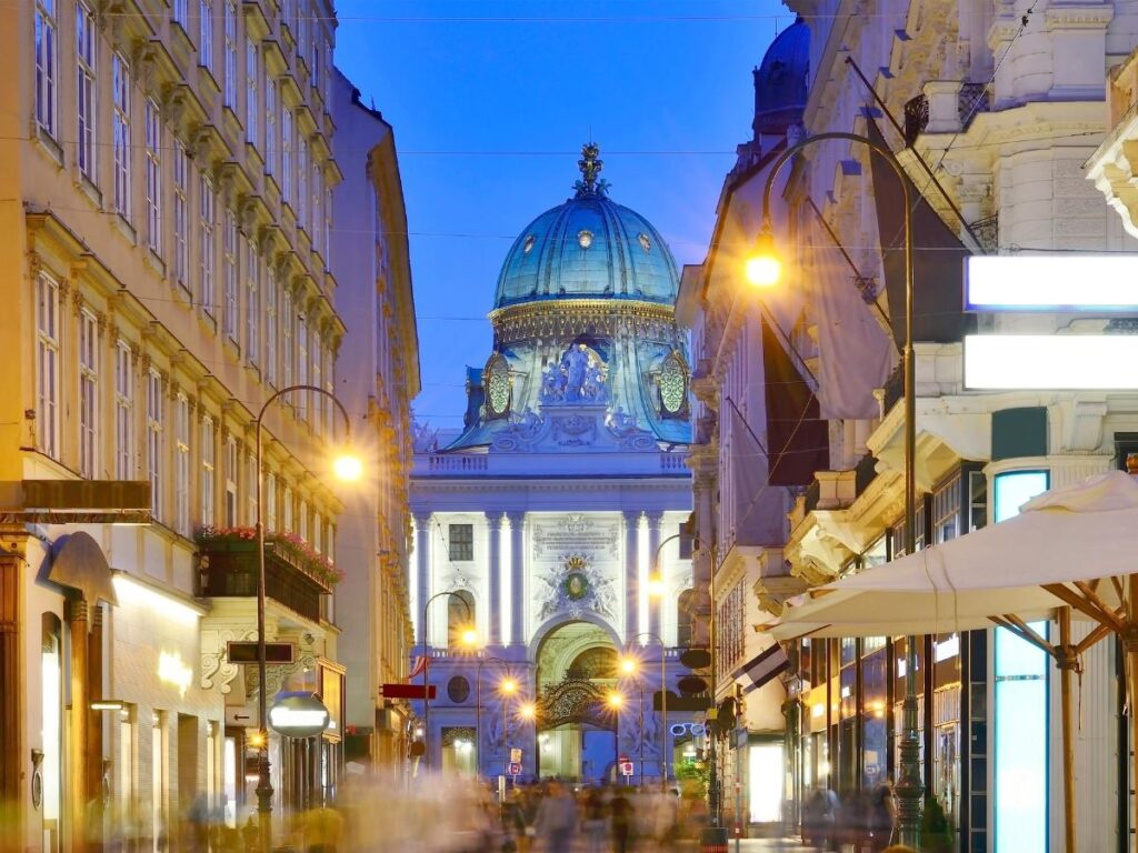 Narrow Getreidegasse street lined with historic wrought-iron shop signs