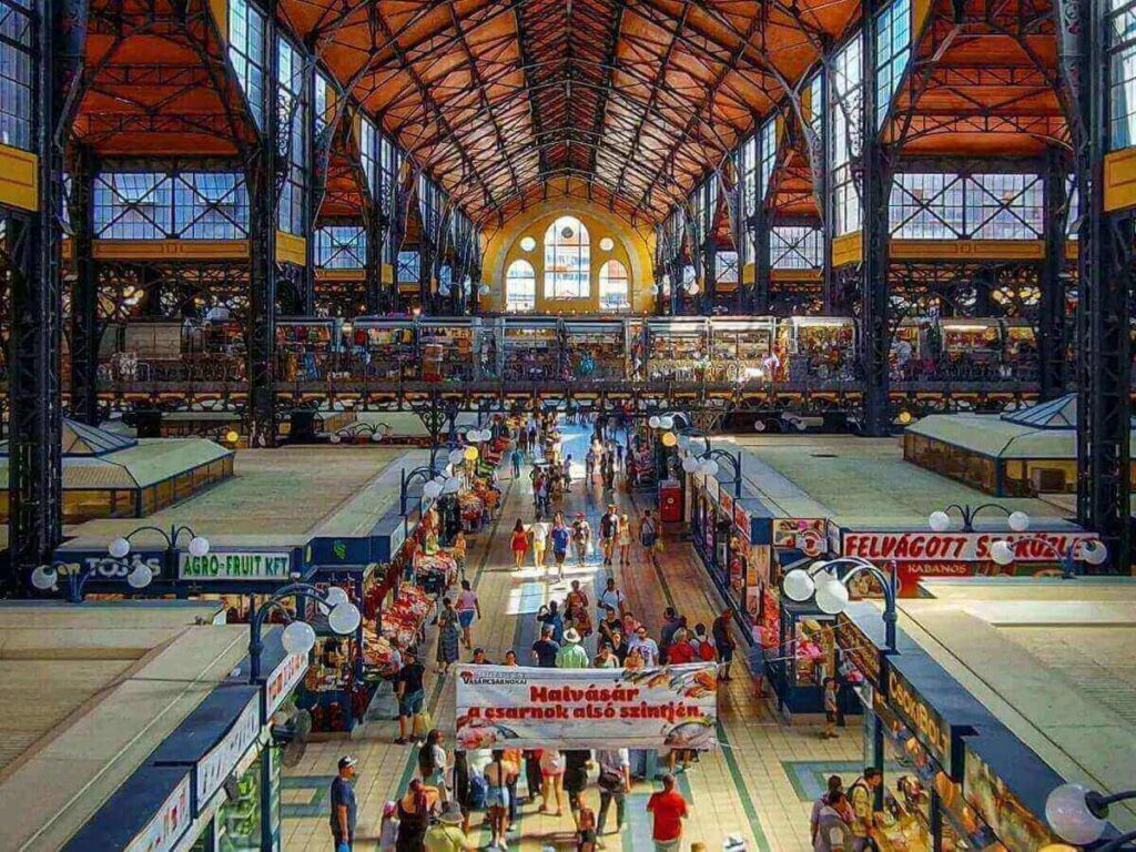 Vibrant stalls selling paprika, produce, and snacks inside Budapest’s Great Market Hall