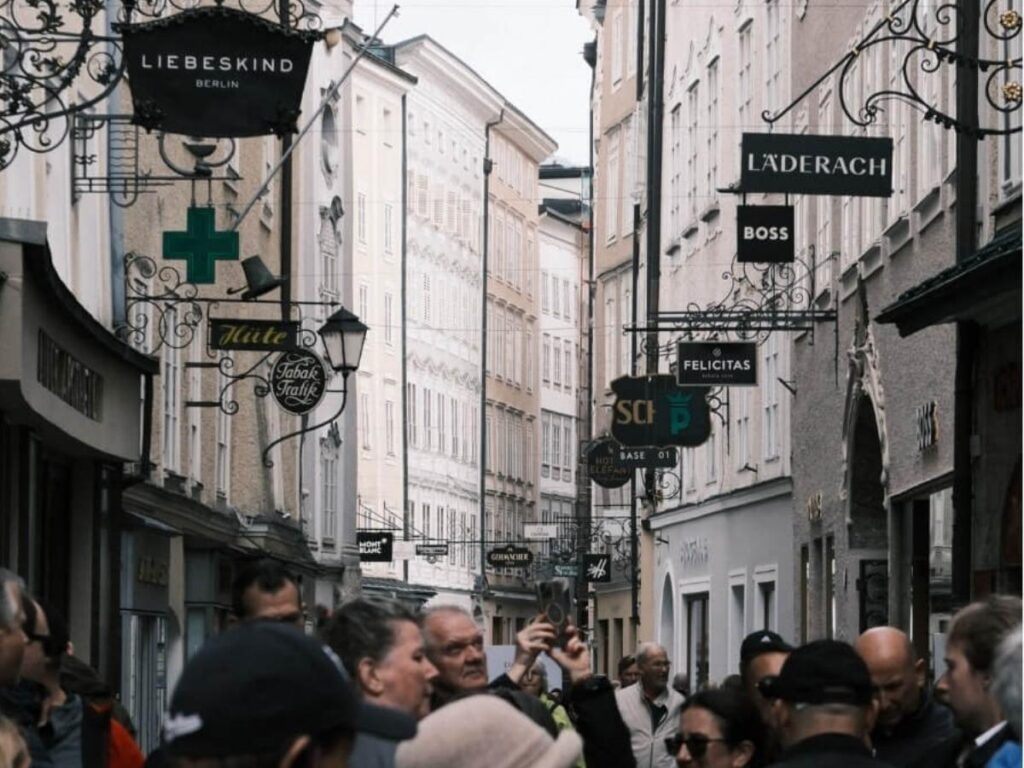 Fresh produce and cheese stalls at Grünmarkt market in Salzburg