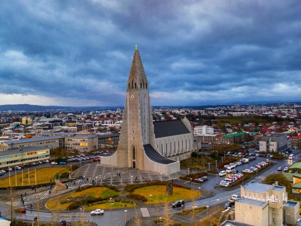 View from Hallgrímskirkja tower overlooking Reykjavík’s colourful rooftops and the bay