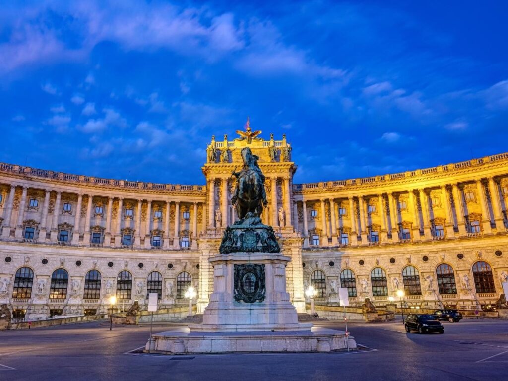 The Hofburg Palace courtyard with tourists and historic façades