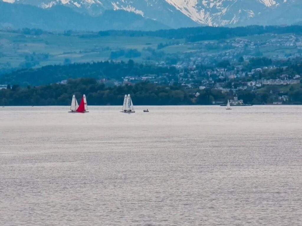 Soft morning light over Lake Zurich with still water and gentle haze