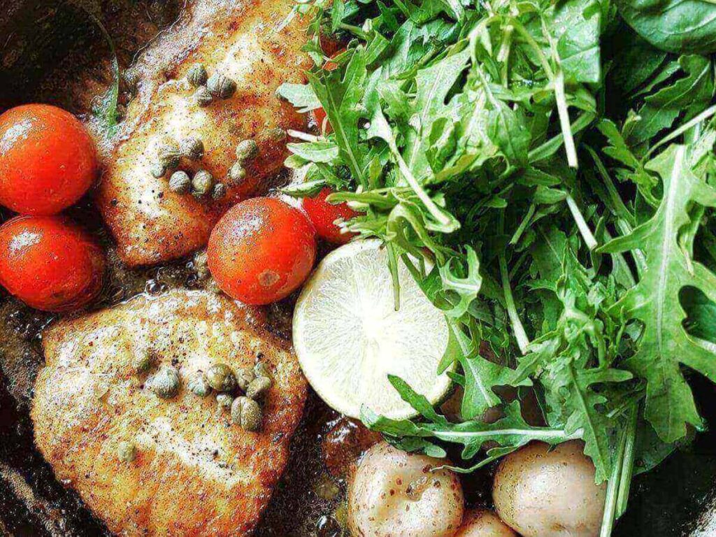 Sizzling fish pan with herbs served at Messinn restaurant in Reykjavík
