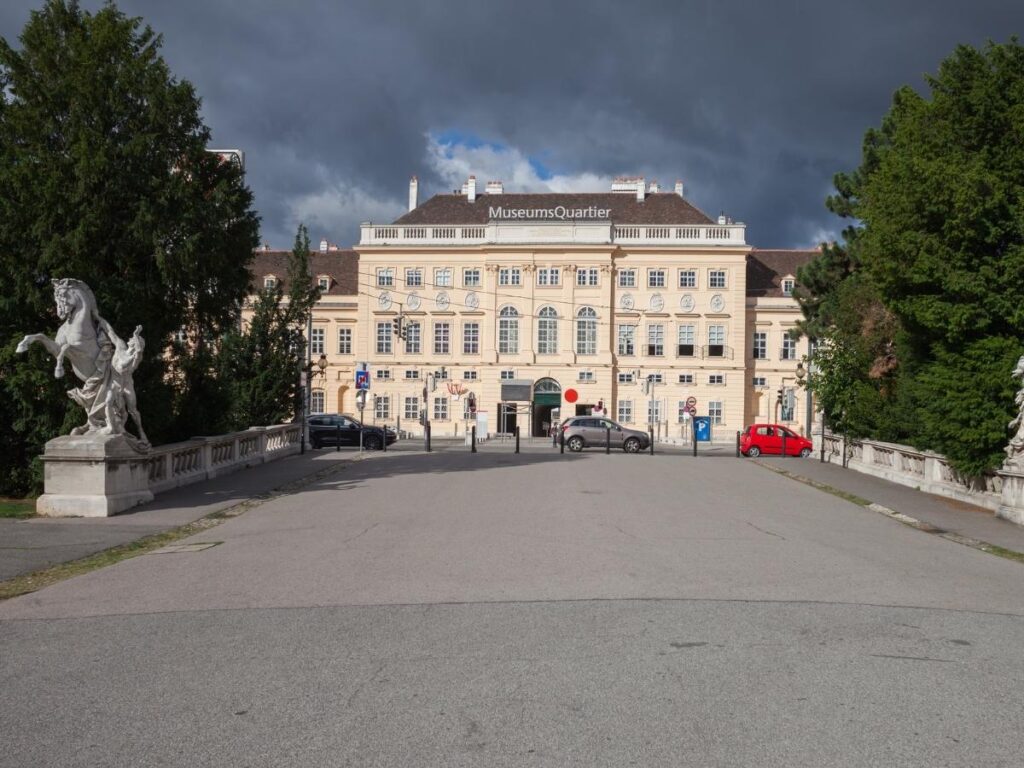 People lounging on colourful seats in the MuseumsQuartier courtyard in Vienna