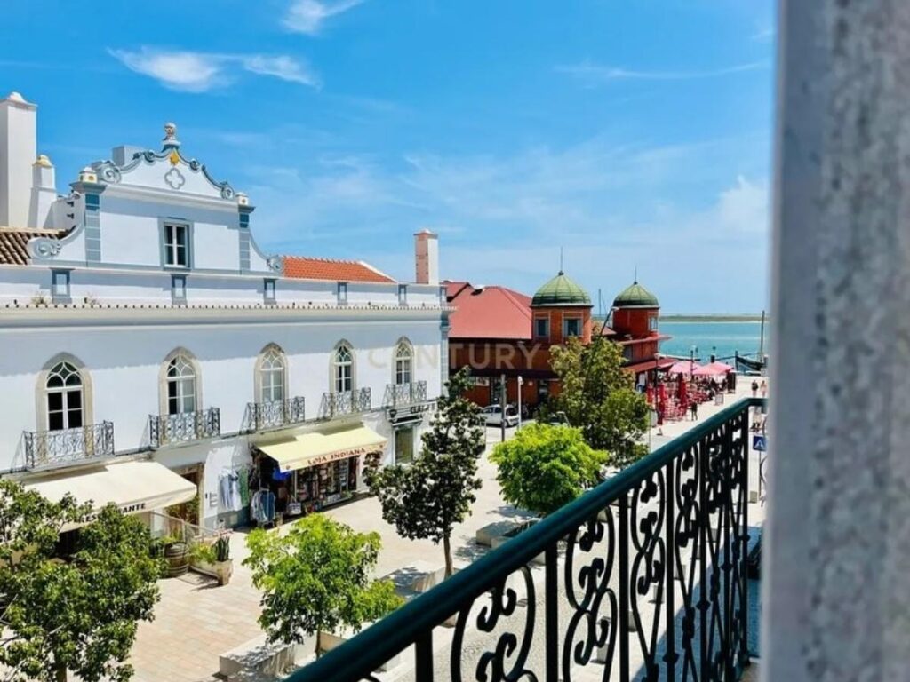 Olhão waterfront promenade at sunset with ferries and cafés, Olhão, Portugal