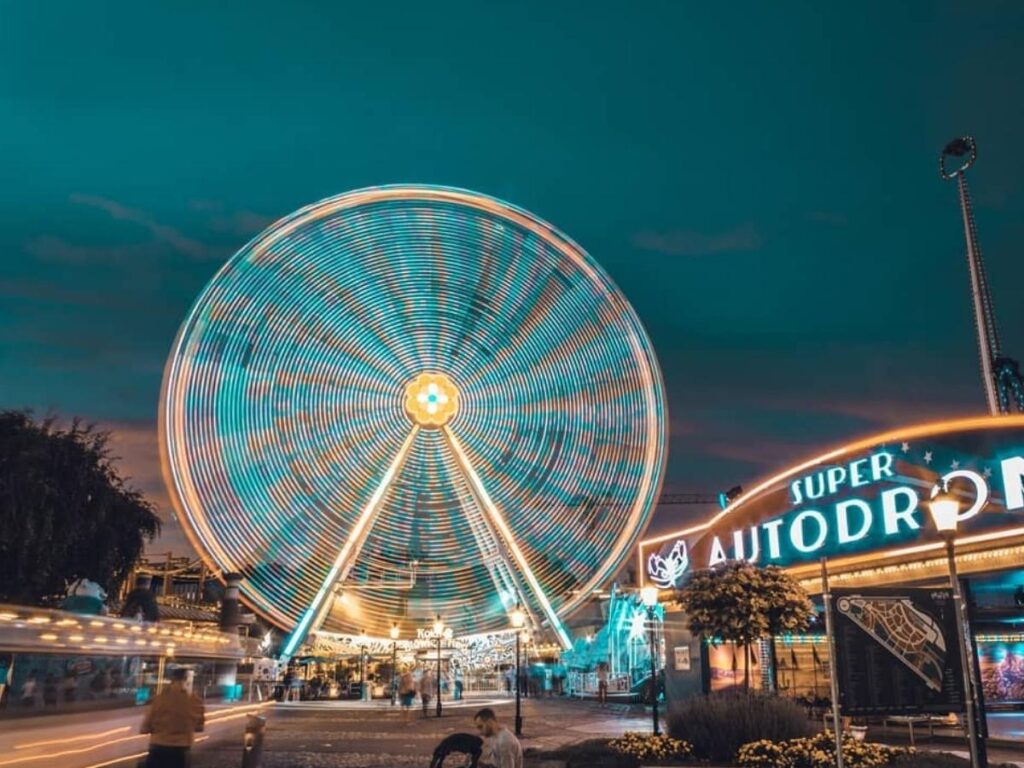 The Prater Riesenrad Ferris wheel lit at dusk with fairground lights