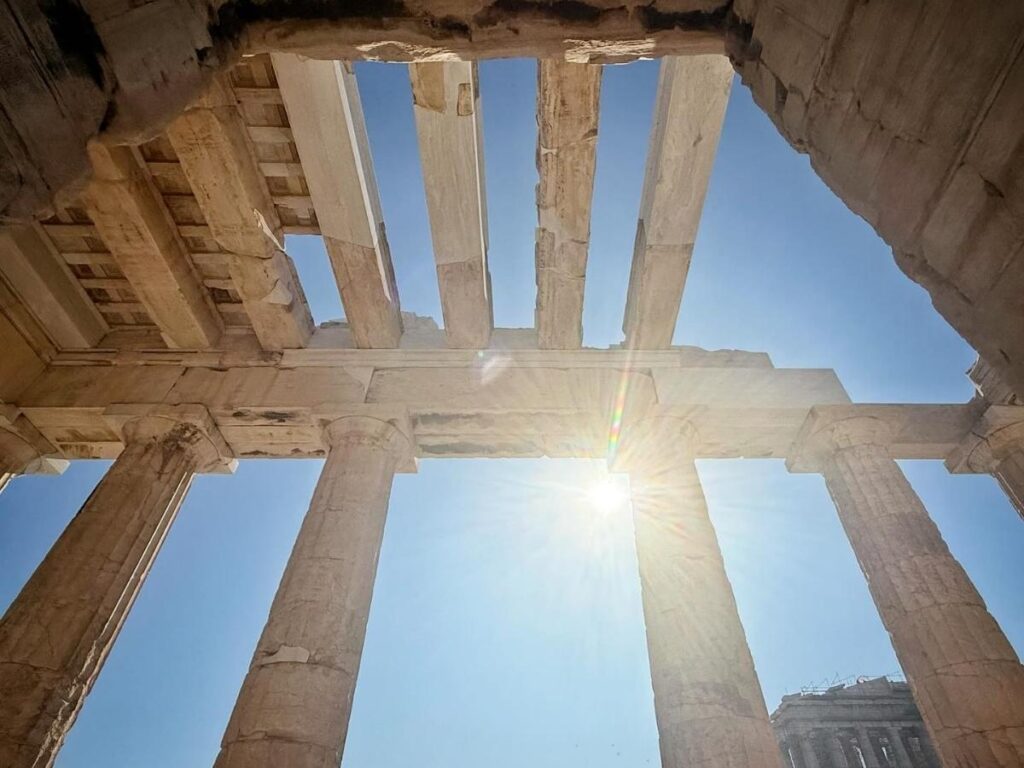 The Propylaea marble gateway on the Acropolis, a shadowed frame leading up to the Parthenon.
