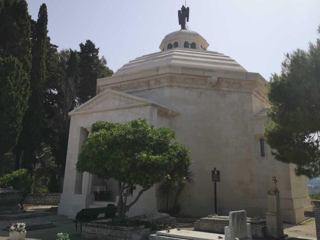 White-stone Račić Mausoleum on the hill with sweeping views over Cavtat’s red roofs and the Adriatic beyond