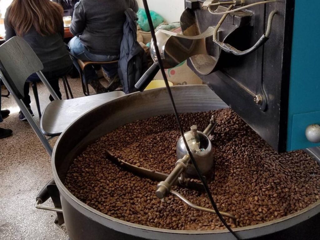 A cup of specialty coffee at Reykjavík Roasters with a cosy, minimalist interior