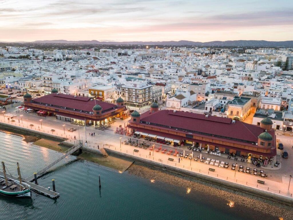 Early-morning fish stalls and vendors at Mercado de Olhão, Ria Formosa