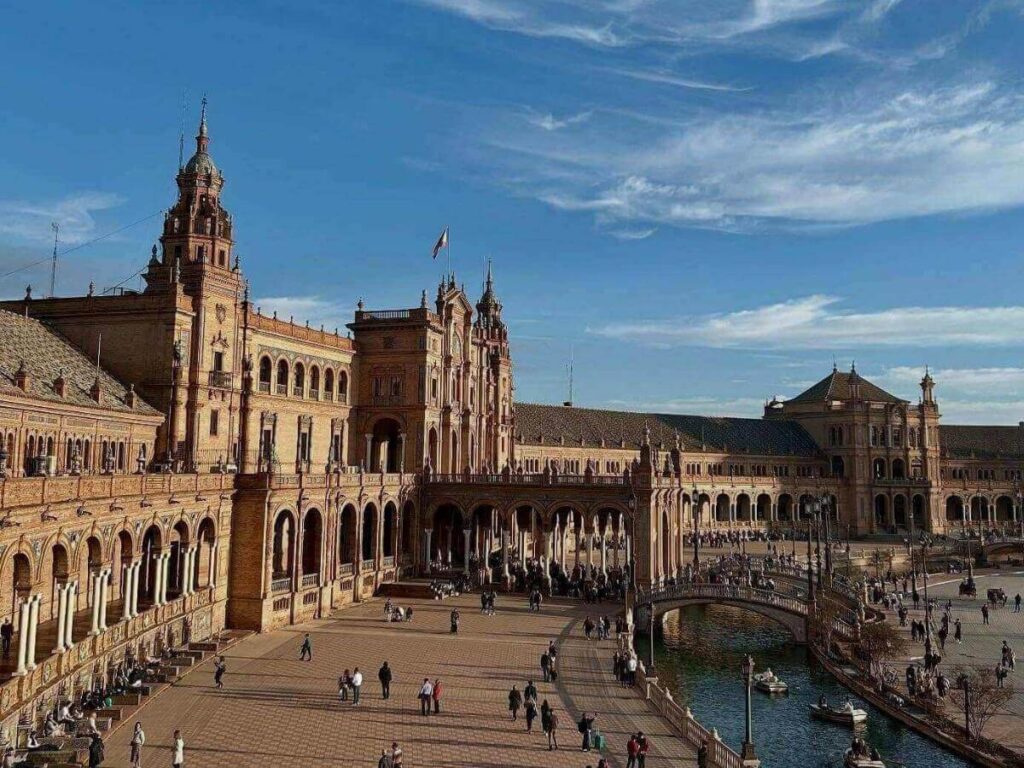 Quiet whitewashed courtyard and bougainvillea in Santa Cruz, Seville