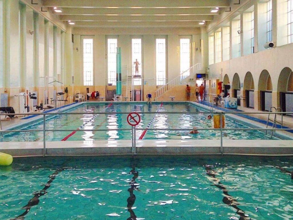 Outdoor geothermal swimming pool at Sundhöllin in Reykjavík on a cool day