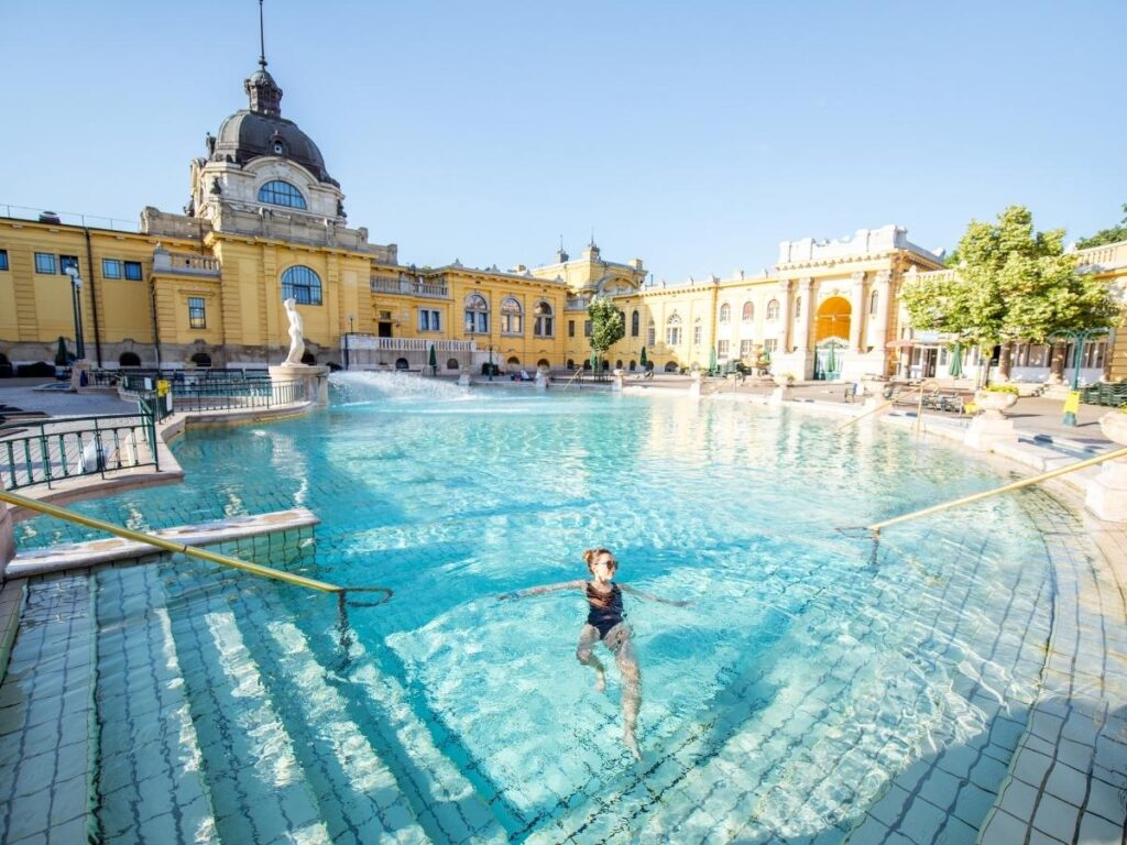 Warm outdoor pools at Széchenyi Thermal Bath with morning steam rising