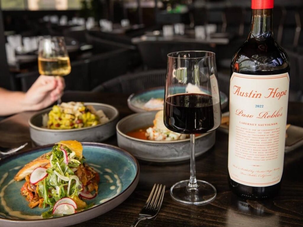 Outdoor lakeside restaurant in Zurich during a summer sunset