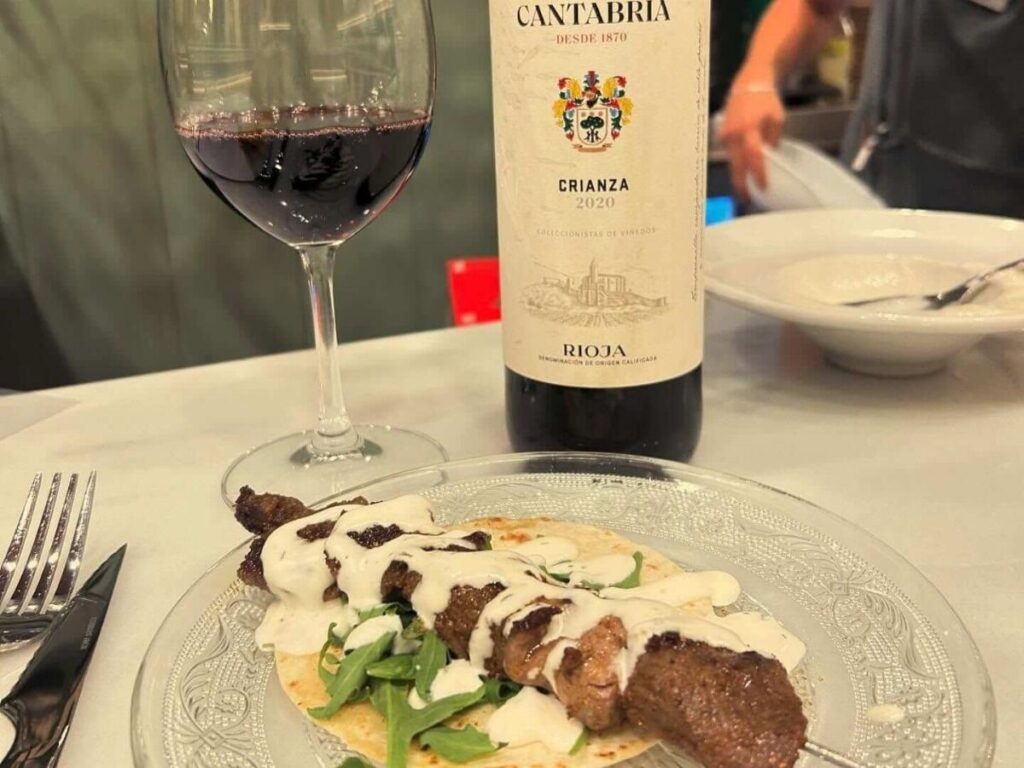 Table of traditional Córdoba dishes including salmorejo, berenjenas con miel, and small tapas plates