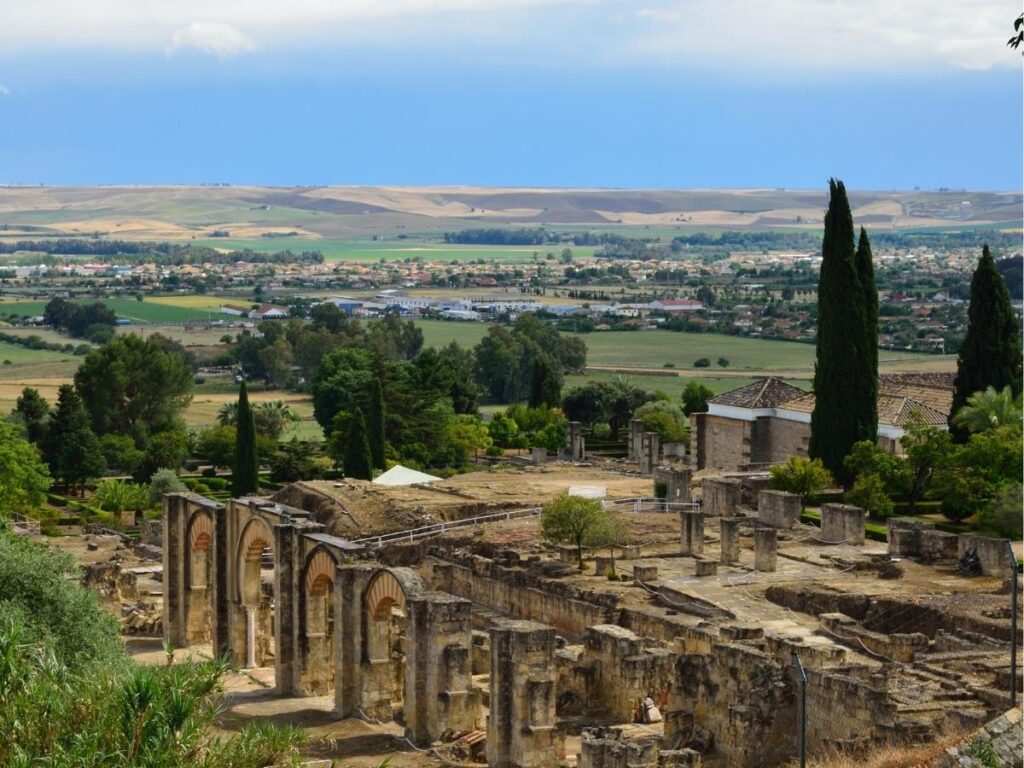 Ruins of Medina Azahara spread across a sunlit hillside outside Córdoba