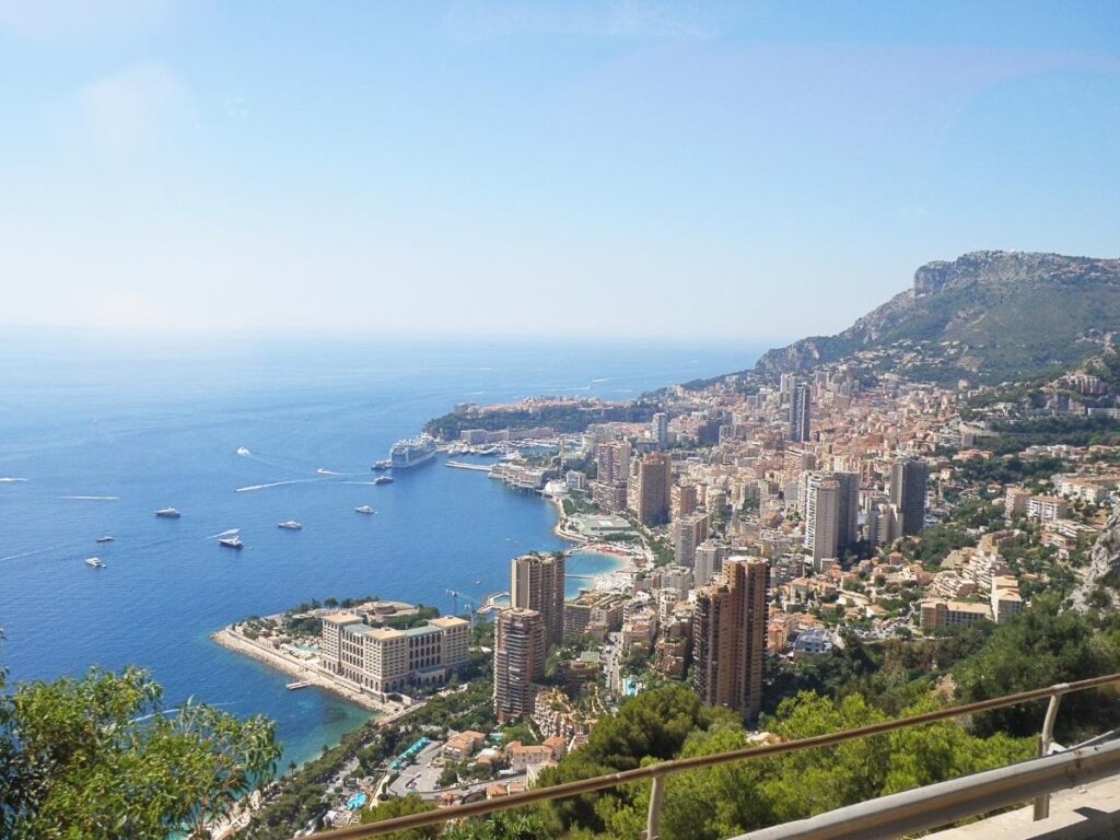 Aerial-style view of Monaco showing the coastline and walking paths