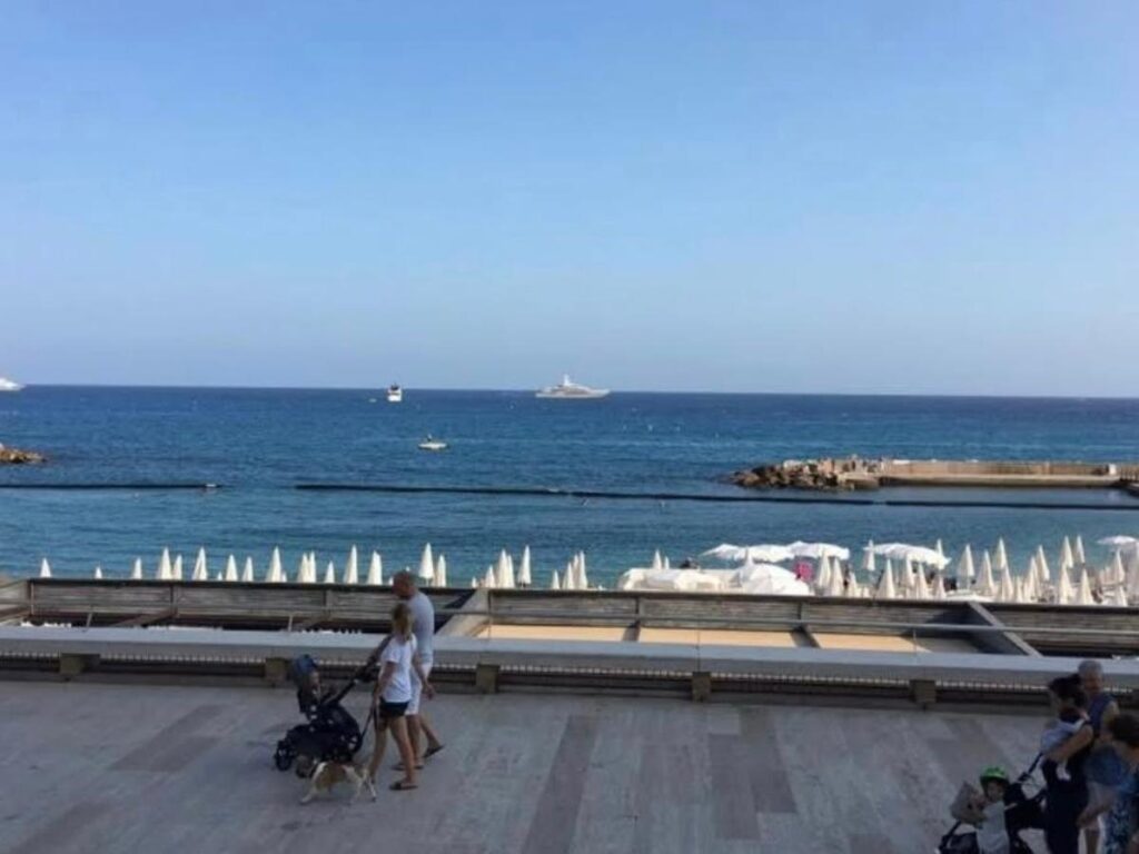 Golden-hour light over Larvotto Beach in Monaco
