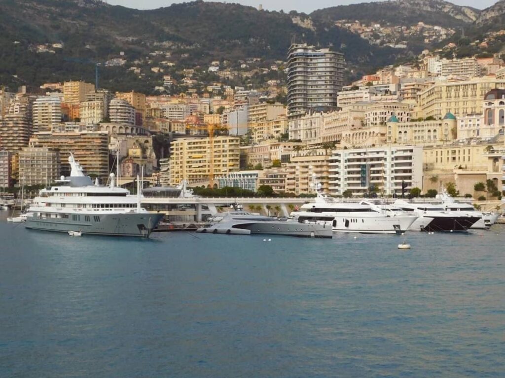 Yachts reflecting in the calm morning water at Port Hercule in Monaco