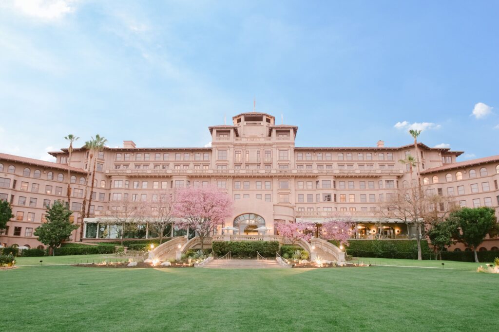 The Langham Huntington Pasadena luxury hotel with gardens and San Gabriel Mountains backdrop