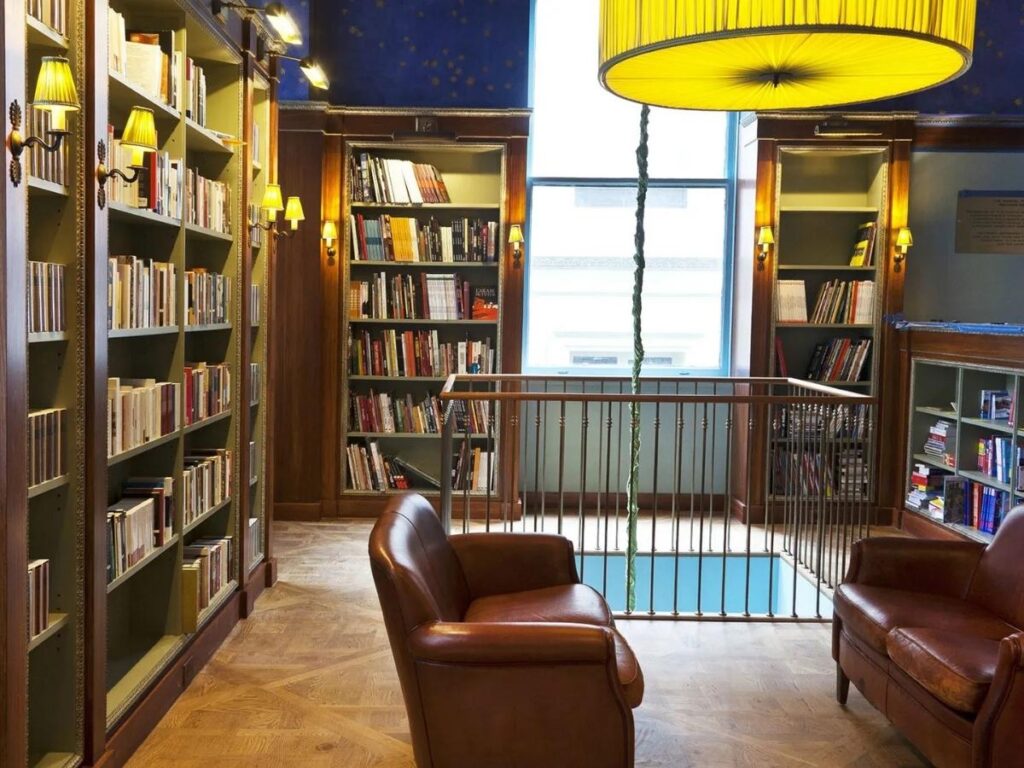 Elegant interior of Albertine French bookstore with floor-to-ceiling shelves near Central Park