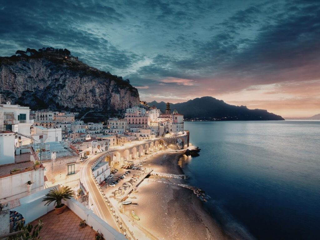 Beautiful coastal town in Italy with colorful buildings overlooking turquoise water