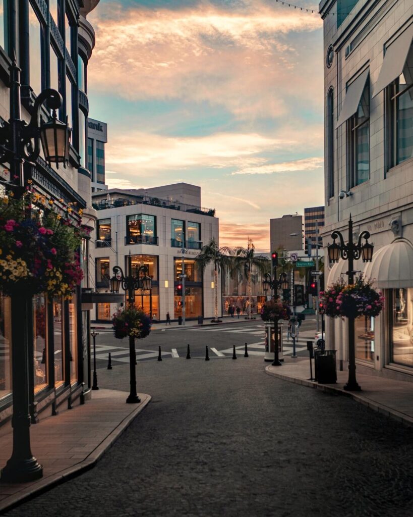 Palm tree lined Bedford Drive street in Beverly Hills with luxury homes