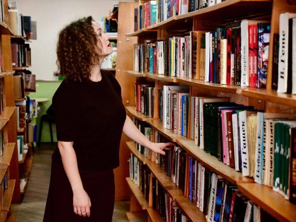  Woman browsing books at independent bookstore in New York City