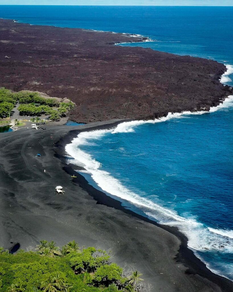 Panoramic view of the Big Island featuring volcanoes, beaches, tropical forests, and mountains