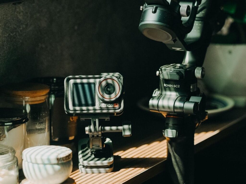 Camera gear, tripod, hiking shoes, and backpack packed for a Big Island photography trip