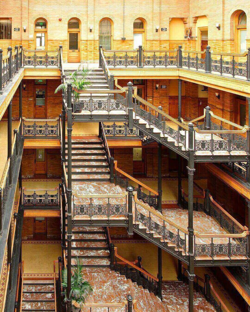 Historic Bradbury Building atrium with iron railings and skylight in Downtown Los Angelesv