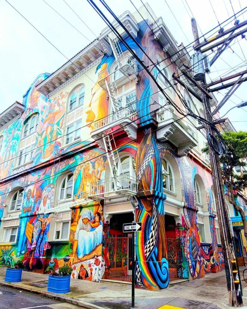 colorful murals painted on walls inside Cayuga Park playground