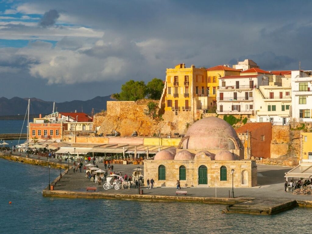 Colorful houses along Chania Venetian harbor in Crete Greece at sunset