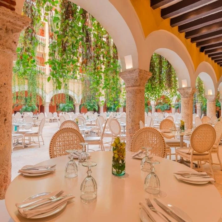 Historic Charleston restaurant interior with exposed brick and warm lighting