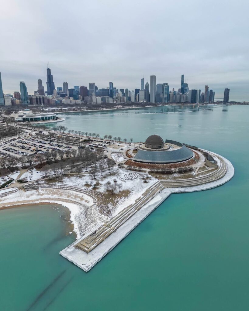 Chicago skyline viewed from Adler Planetarium steps at sunset