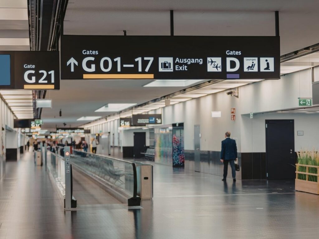 Closed airplane boarding gate with empty jet bridge after departure