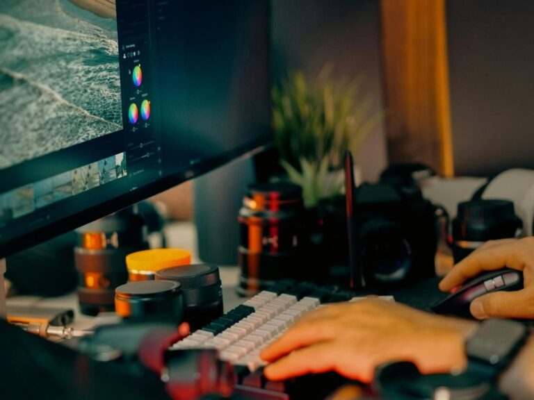 Cozy French cafe workspace with laptop, espresso, and window view of cobblestone street perfect for remote workers