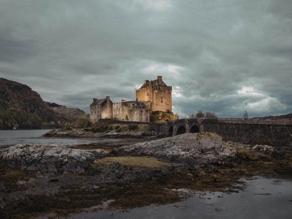 Emerald green waters of An Lochan Uaine surrounded by pine forest near Aviemore