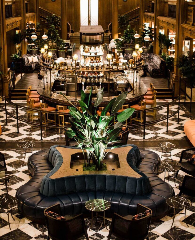 grand lobby of the Fairmont San Francisco hotel with chandeliers and columns