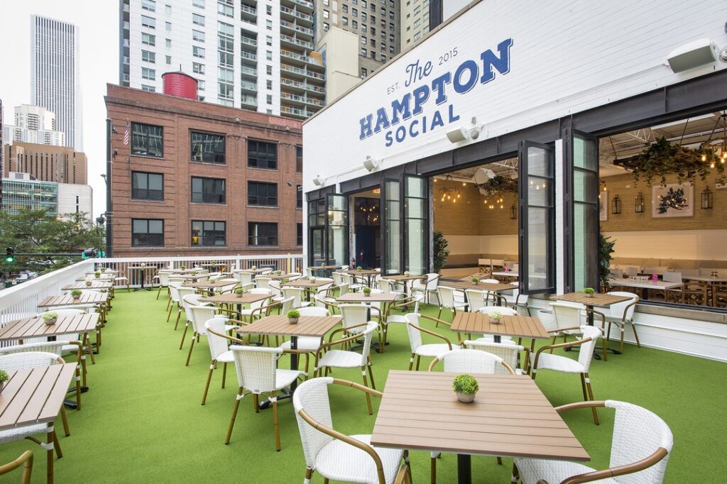 Signature flower wall inside Hampton Social restaurant in Chicago