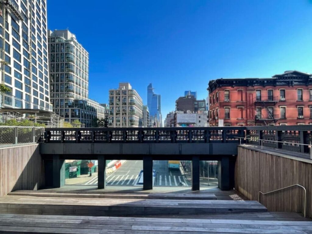 Glass window overlook at 10th Avenue Square on the High Line with street view below