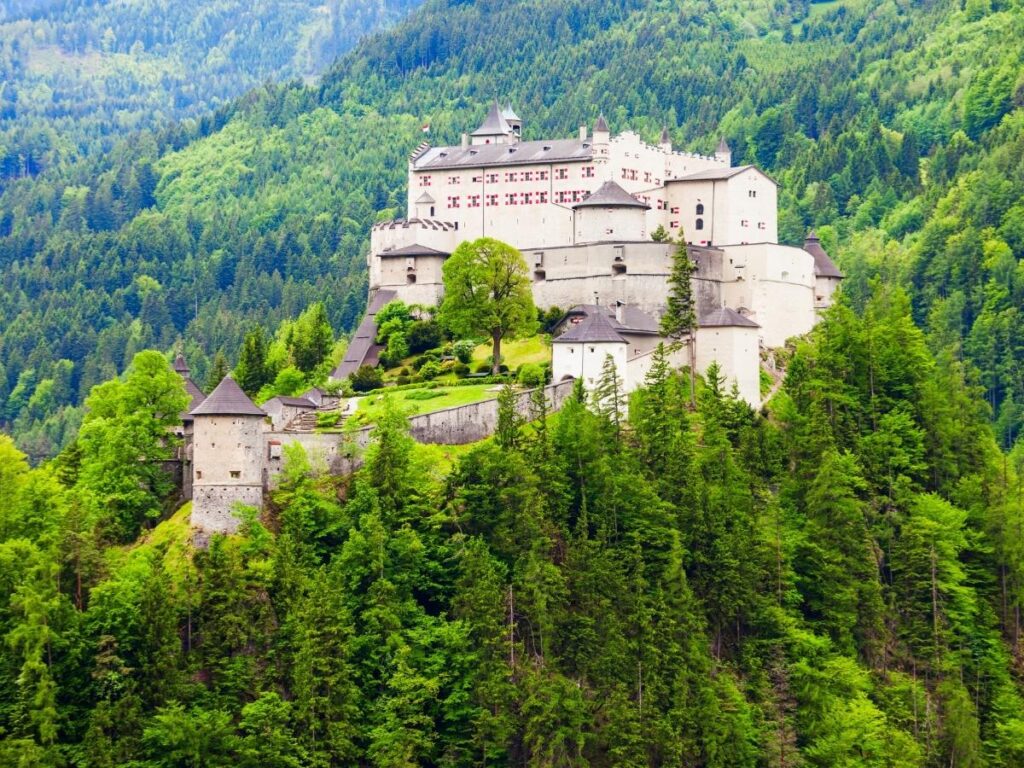 Hohenwerfen Castle perched on rocky cliff above Werfen village in Austrian Alps