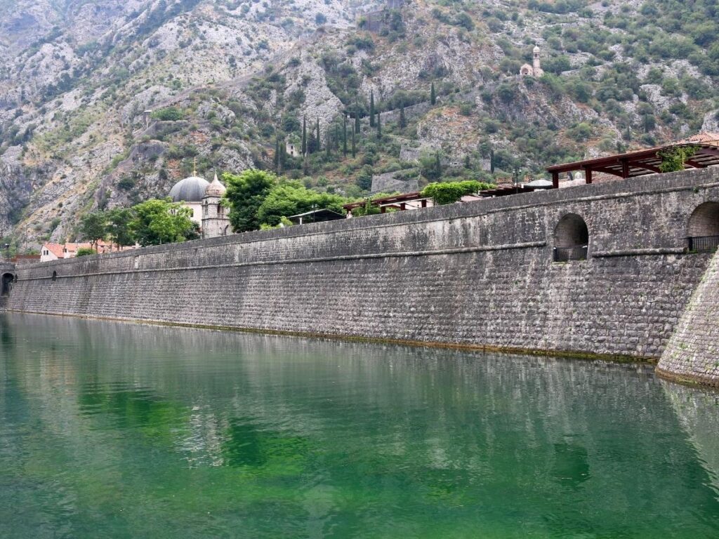 Bay of Kotor Montenegro with medieval fortress walls climbing hillside