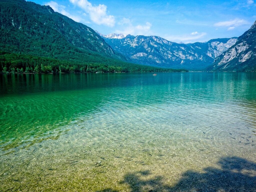 Lake Bohinj surrounded by Julian Alps mountains in Triglav National Park Slovenia