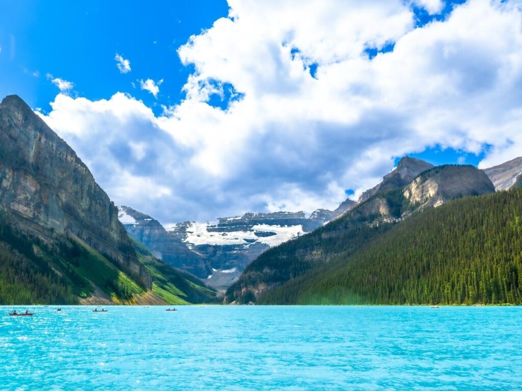 Turquoise waters of Lake Louise surrounded by snow-capped mountains in Banff National Park
