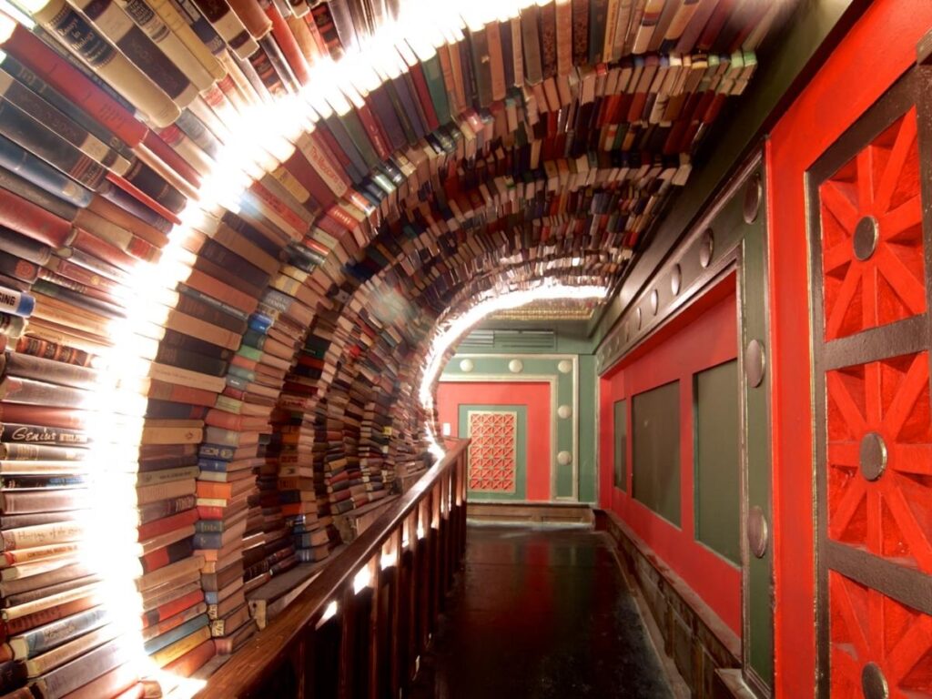 Book tunnel archway and art installations at The Last Bookstore in downtown Los Angeles