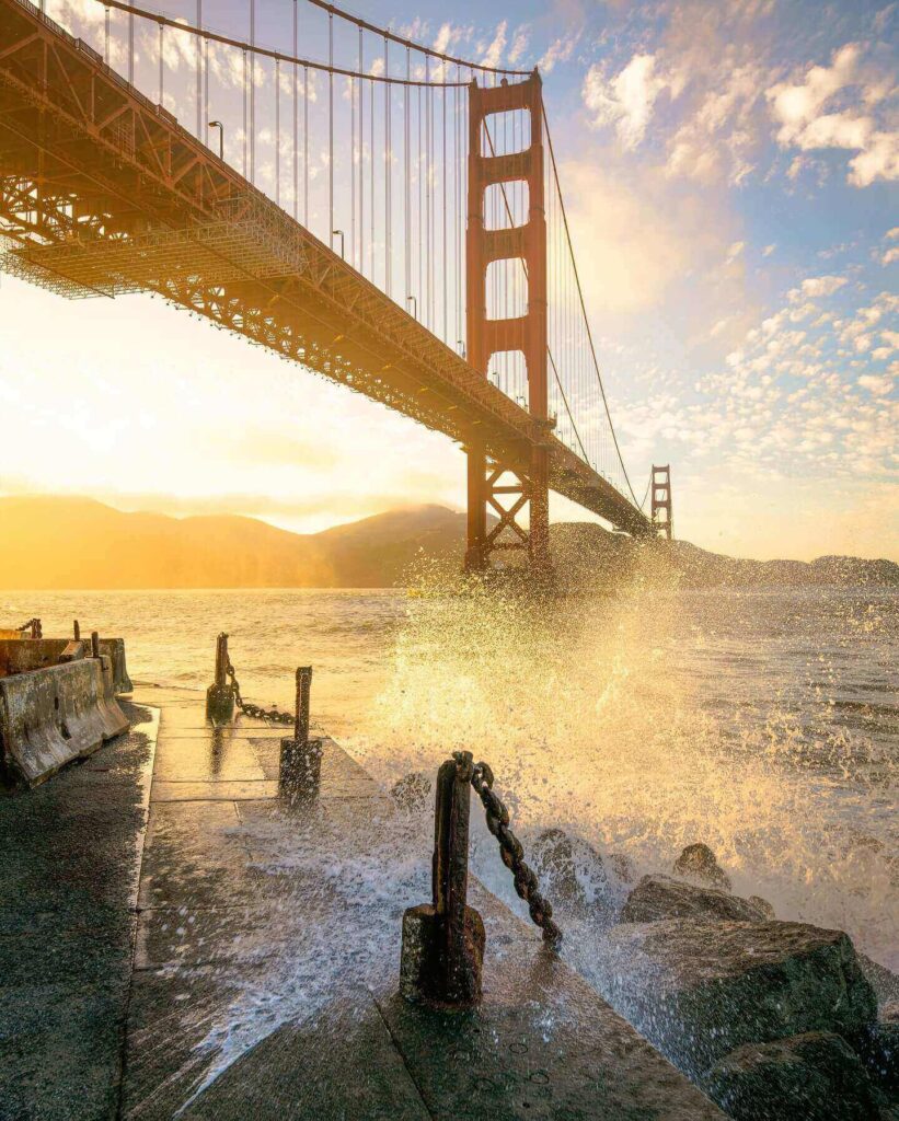 Golden Gate Bridge at sunrise viewed from the rocky shoreline of Marshall’s Beach