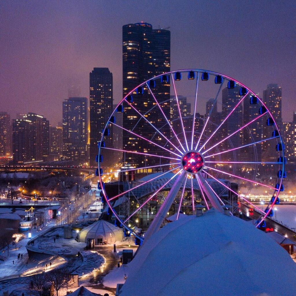 Navy Pier Ferris wheel with sunset over Lake Michigan in Chicago