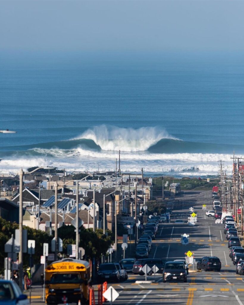 wide sandy Ocean Beach with Pacific waves and surfers in San Francisco